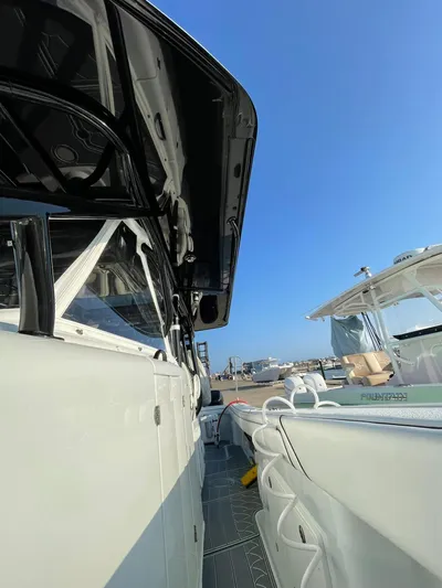 Saltwater Lady Yacht Photos Pics 2016 Yellowfin 42 boat docked under clear blue sky.