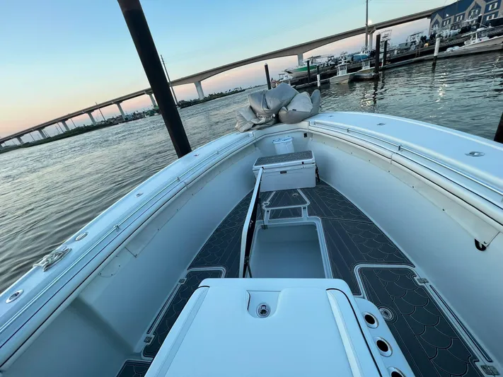 Saltwater Lady Yacht Photos Pics 2016 Yellowfin 42 boat docked at marina with bridge in background.