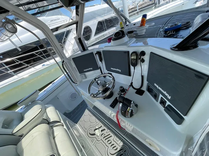 Saltwater Lady Yacht Photos Pics 2016 Yellowfin 42 boat cockpit with advanced navigation system and comfortable seating.