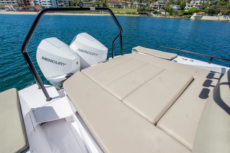  Yacht Photos Pics 2022 Axopar 28 Cabin boat with twin Mercury engines and sunbathing deck.