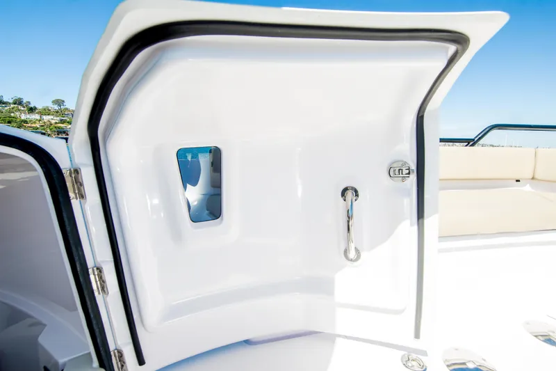  Yacht Photos Pics 2022 Axopar 28 Cabin boat door with sleek design and chrome handle.