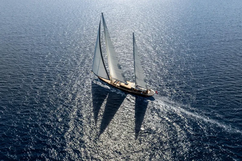 Sallyna Yacht Photos Pics Aerial view of 2023 Su Marine sailing yacht gliding on sparkling blue ocean.