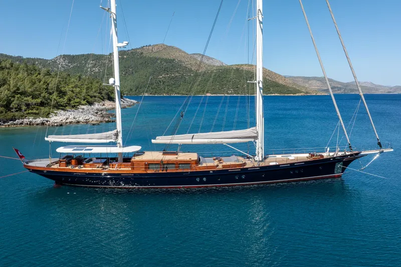 Sallyna Yacht Photos Pics Luxurious 2023 Su Marine sailing yacht anchored in serene blue waters.