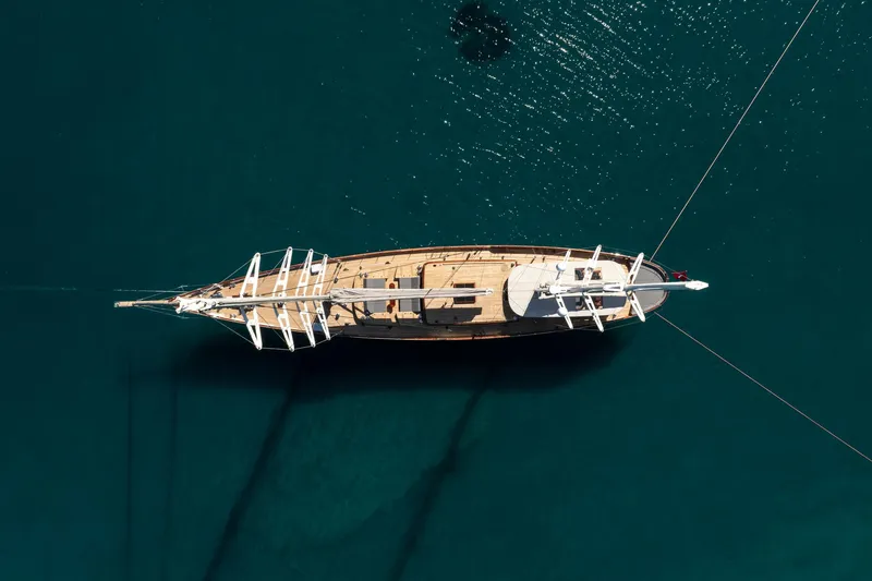 Sallyna Yacht Photos Pics Aerial view of 2023 Su Marine sailing yacht on calm blue water.
