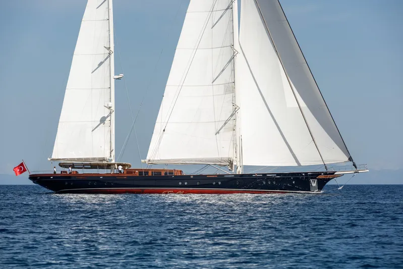 Sallyna Yacht Photos Pics 2023 Su Marine sailing yacht with white sails on open sea.