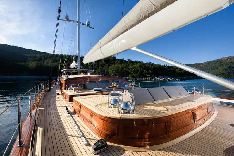 Sallyna Yacht Photos Pics Luxurious 2023 Su Marine sailing yacht with elegant wooden deck and scenic ocean view.