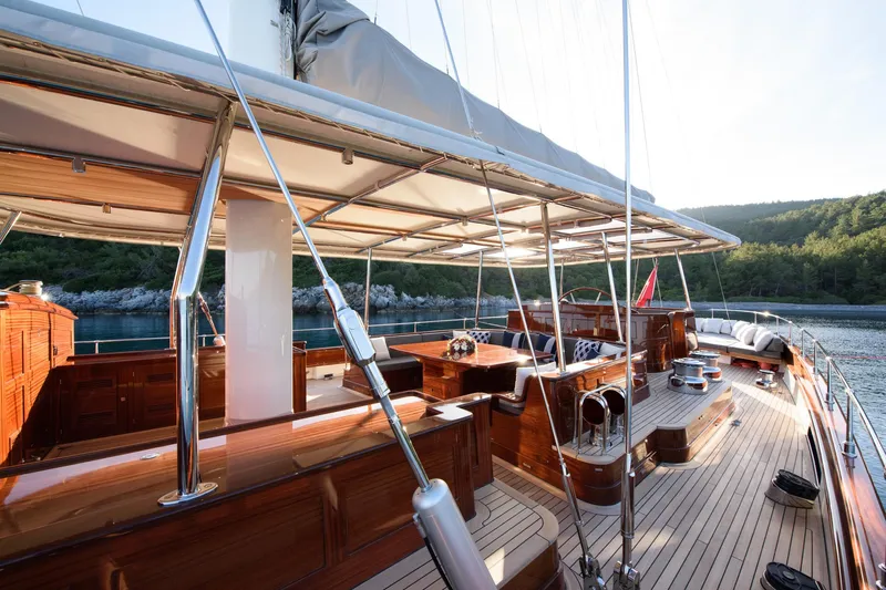 Sallyna Yacht Photos Pics Luxurious 2023 Su Marine sailing yacht with elegant wooden deck and spacious seating area.