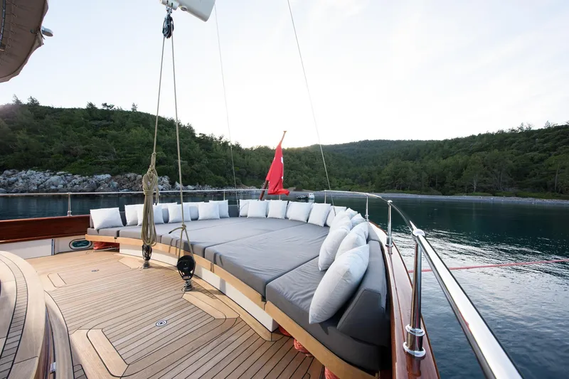 Sallyna Yacht Photos Pics Luxurious 2023 Su Marine sailing yacht with spacious deck and scenic coastal view.