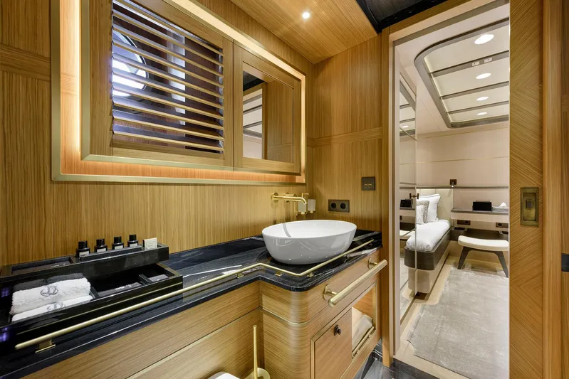 Sallyna Yacht Photos Pics Luxurious 2023 Su Marine sailing yacht bathroom with elegant wood finishes and modern fixtures.