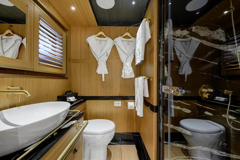 Sallyna Yacht Photos Pics Luxurious bathroom on 2023 Su Marine sailing yacht with elegant fixtures and wooden accents.