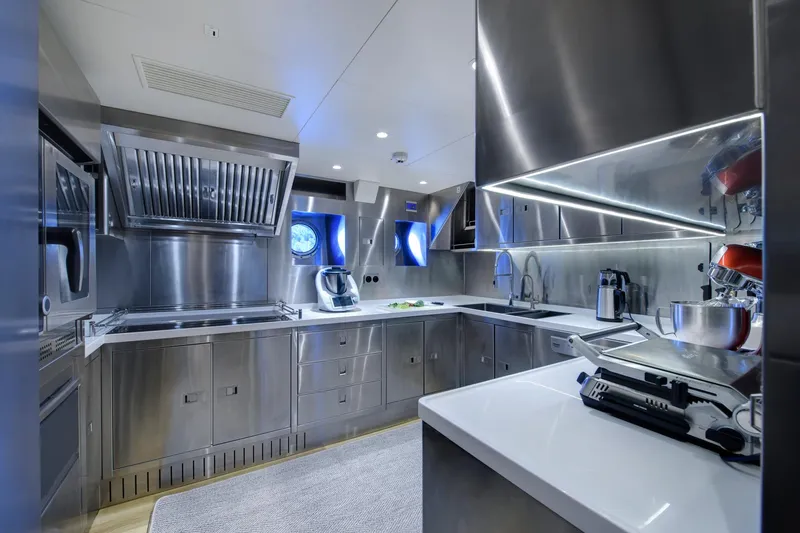 Sallyna Yacht Photos Pics Modern stainless steel kitchen in 2023 Su Marine sailing yacht, featuring sleek appliances and ample counter space.