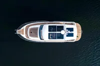 Aerial view of 2024 Nimbus 365 Coupe yacht on dark water.
