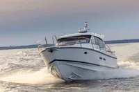 2024 Nimbus 365 Coupe cruising on open water at high speed.