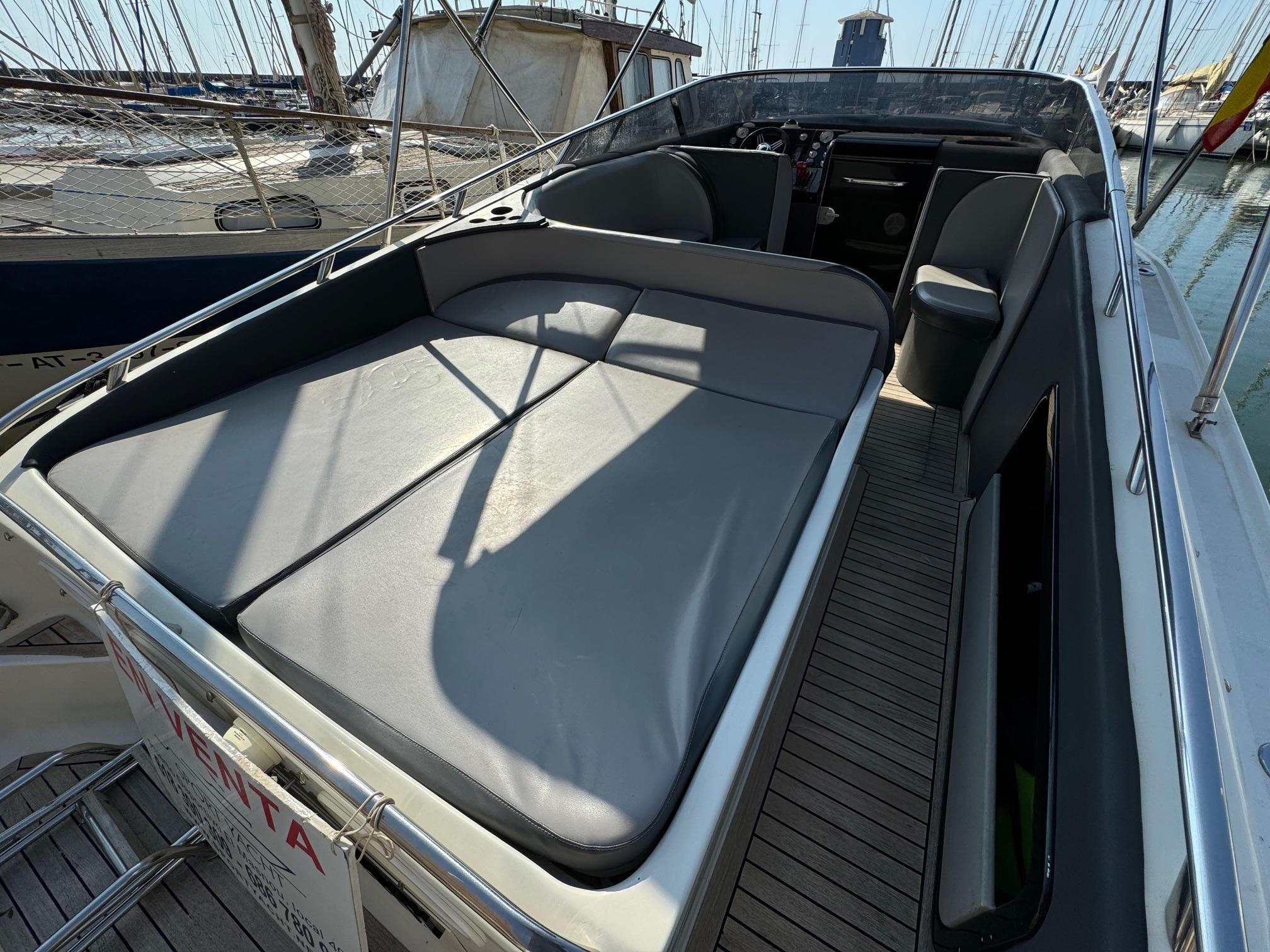 1997 Performance 1107 boat with spacious seating, docked at marina.