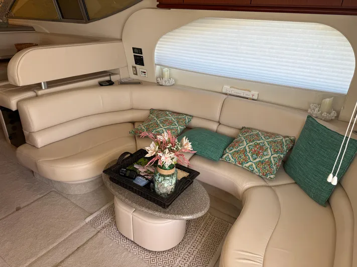 Jjetsdream Yacht Photos Pics Luxurious interior of 1999 Maxum 4600 SCB yacht with plush seating and decorative pillows.