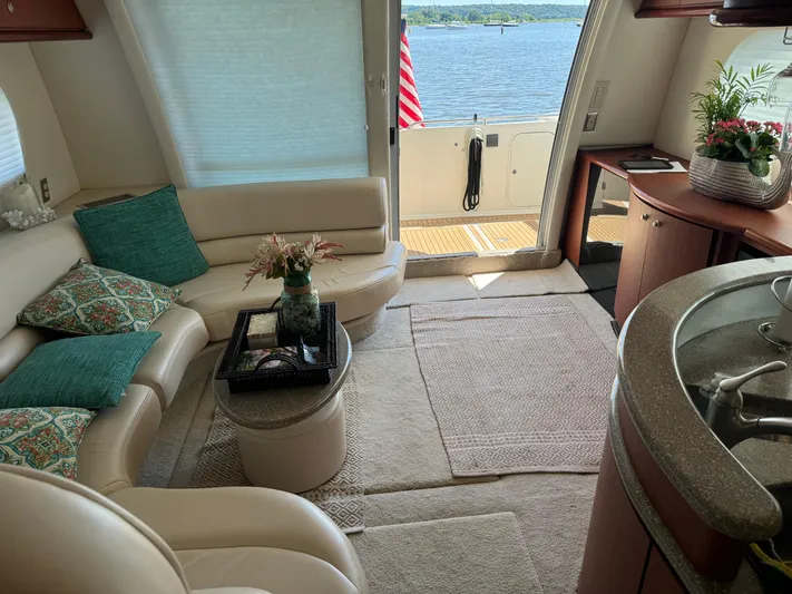 Jjetsdream Yacht Photos Pics Luxurious interior of 1999 Maxum 4600 SCB yacht with elegant seating and scenic water view.