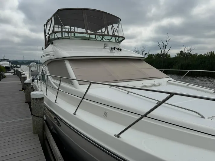 Jjetsdream Yacht Photos Pics 1999 Maxum 4600 SCB yacht docked under cloudy skies.
