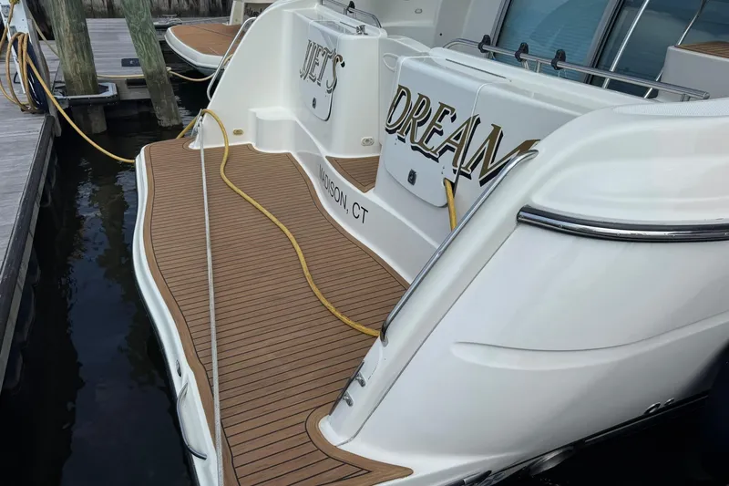 Jjetsdream Yacht Photos Pics 1999 Maxum 4600 SCB yacht docked, featuring teak deck and elegant design.