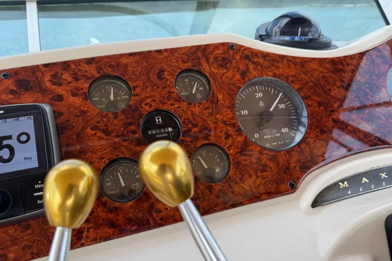 Jjetsdream Yacht Photos Pics Dashboard of a 1999 Maxum 4600 SCB boat with gauges and controls.