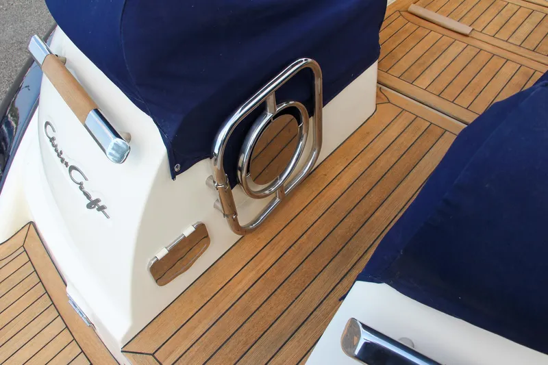 Phoenix Yacht Photos Pics 2017 Chris-Craft Launch 36 boat with teak deck and navy blue covers.