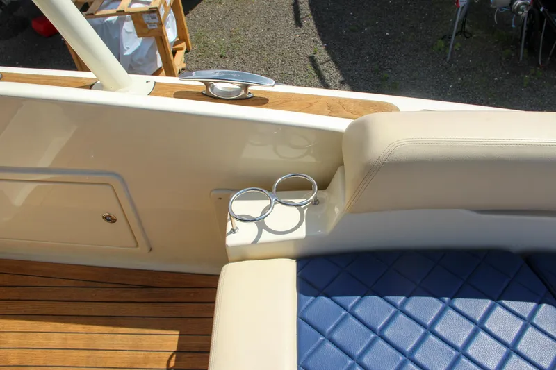 Phoenix Yacht Photos Pics 2017 Chris-Craft Launch 36 interior with blue diamond-stitched seating and cup holders.