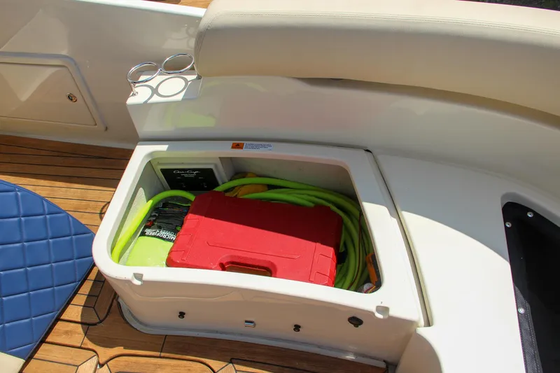 Phoenix Yacht Photos Pics 2017 Chris-Craft Launch 36 storage compartment with tools and hose.