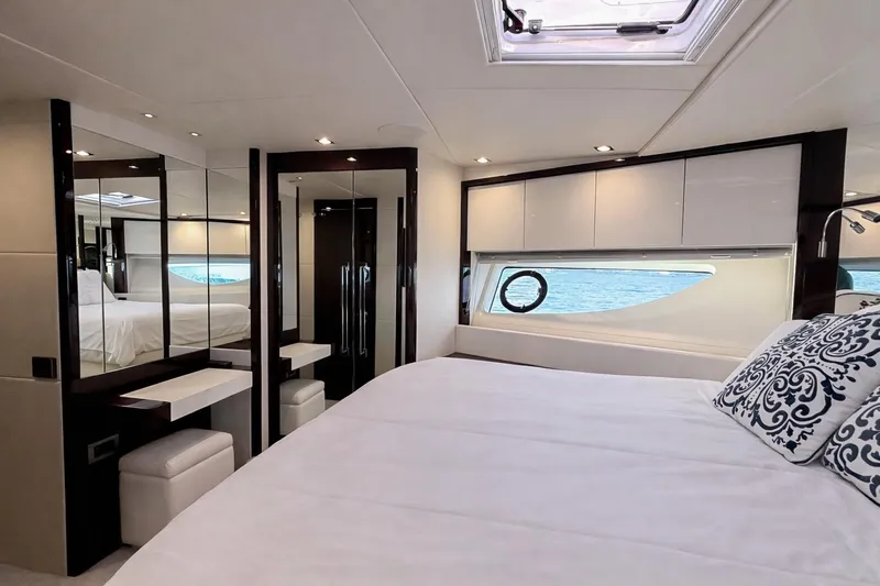 Solaire Yacht Photos Pics Luxurious bedroom interior of 2019 Sunseeker 76 Yacht with ocean view.