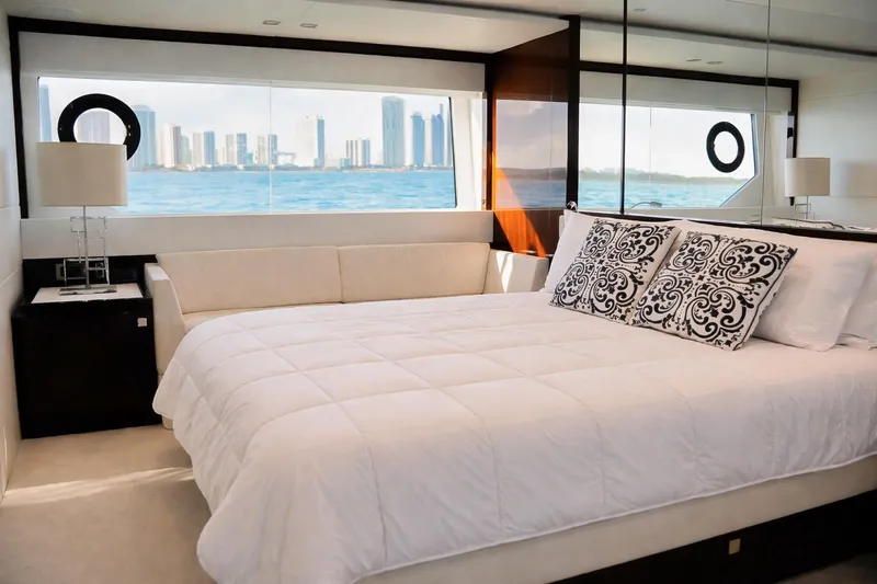 Solaire Yacht Photos Pics Luxurious bedroom interior of 2019 Sunseeker 76 Yacht with ocean view.