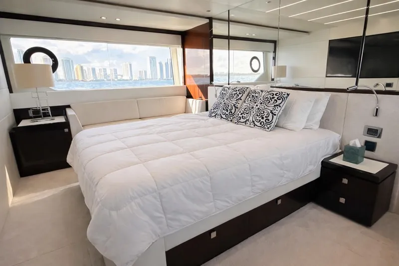 Solaire Yacht Photos Pics Luxurious bedroom interior of 2019 Sunseeker 76 Yacht with ocean view.