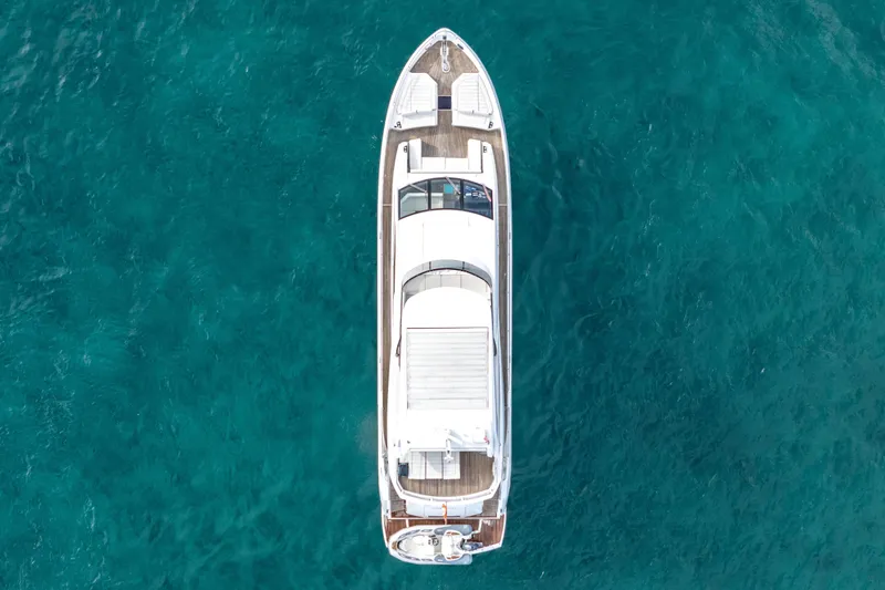 Solaire Yacht Photos Pics Overhead view of 2019 Sunseeker 76 Yacht on clear blue water.