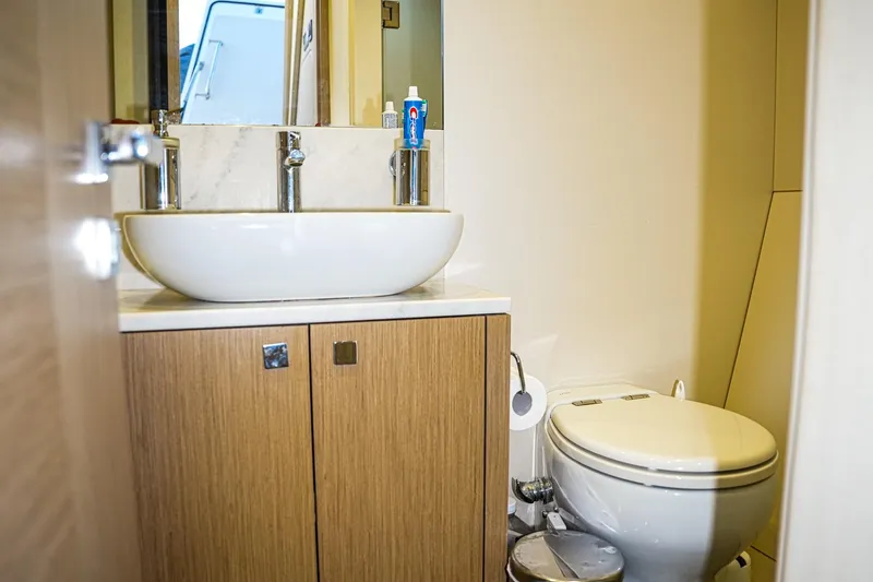 Solaire Yacht Photos Pics Luxurious bathroom in 2019 Sunseeker 76 Yacht with modern fixtures and elegant design.