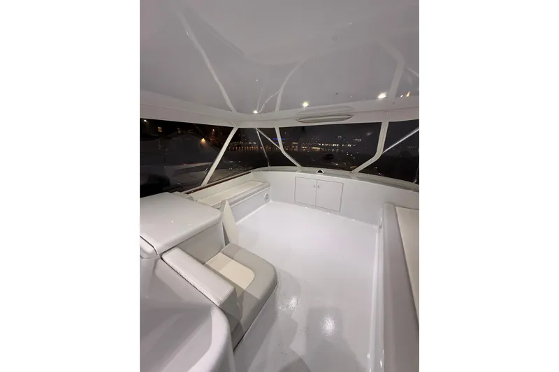  Yacht Photos Pics Luxurious interior of 2006 Blackwell 66 Convertible yacht at night.