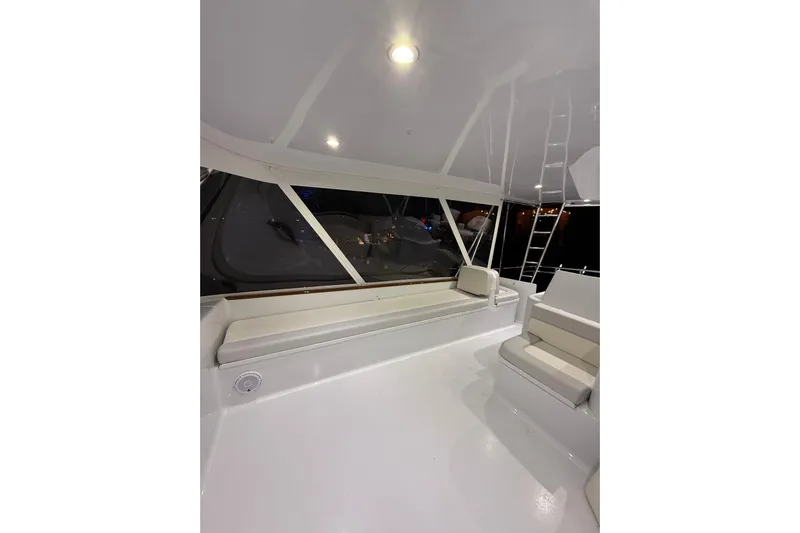  Yacht Photos Pics 2006 Blackwell 66 Convertible yacht interior with white seating and ladder.