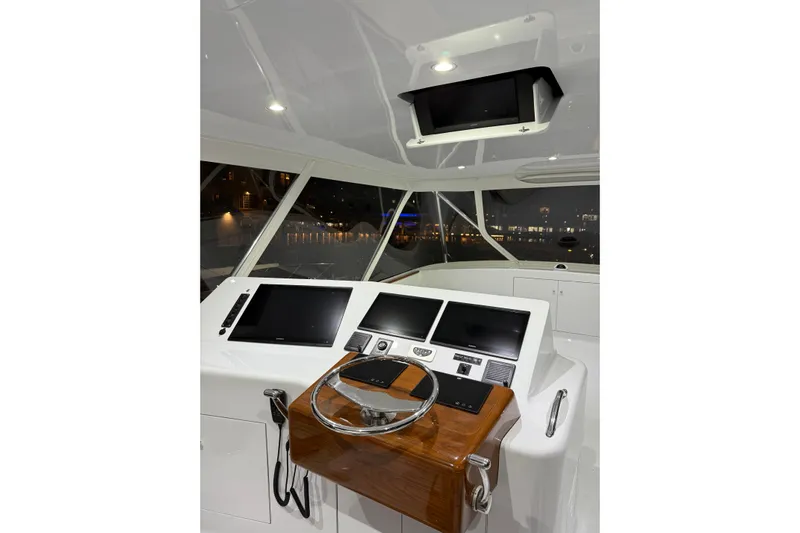 Yacht Photos Pics Interior view of 2006 Blackwell 66 Convertible yacht cockpit with modern navigation equipment.