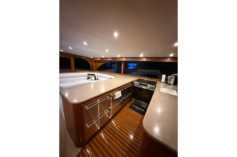 Yacht Photos Pics Luxurious interior of 2006 Blackwell 66 Convertible yacht with modern kitchen amenities.