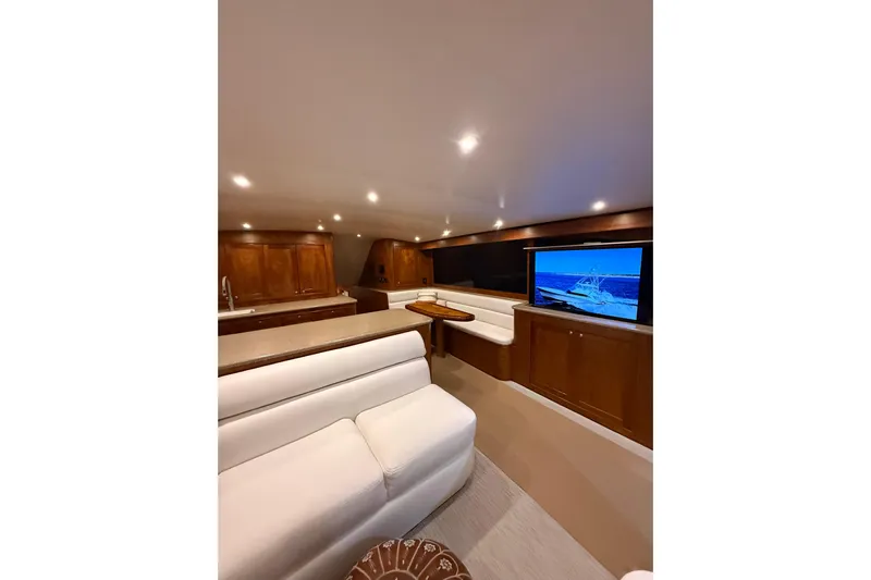  Yacht Photos Pics Luxurious interior of 2006 Blackwell 66 Convertible yacht with plush seating and modern amenities.