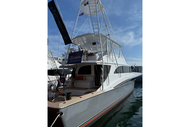  Yacht Photos Pics 2006 Blackwell 66 Convertible yacht docked, featuring a sleek design and fishing equipment.