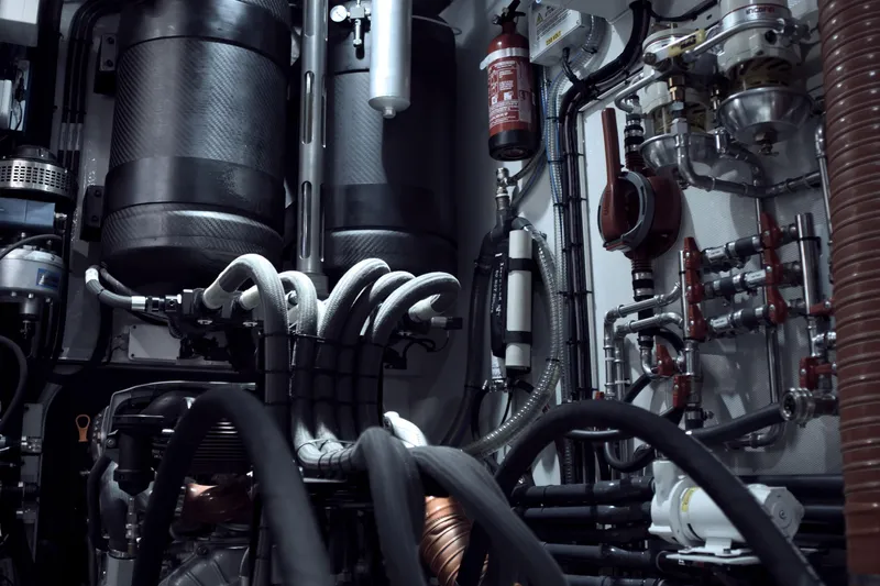 Bullitt Yacht Photos Pics Engine room of a 2018 Wally Custom yacht with complex machinery and piping.