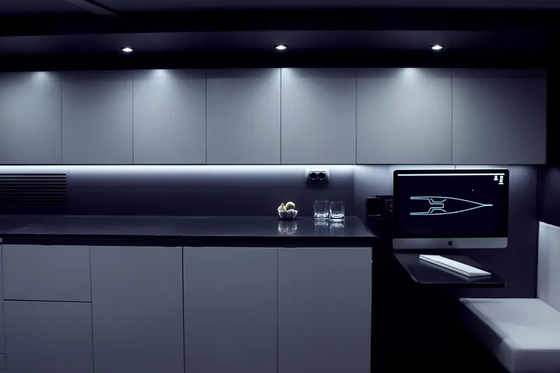 Bullitt Yacht Photos Pics Modern yacht interior with sleek cabinetry, computer, and ambient lighting, Wally Custom 2018 model.