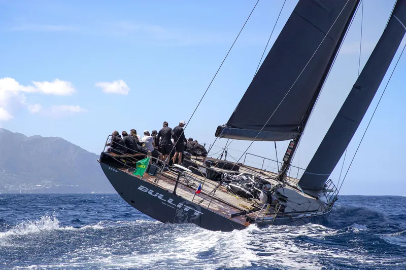 Bullitt Yacht Photos Pics Sailing yacht "Wally Custom 2018" navigating ocean waves with crew onboard.