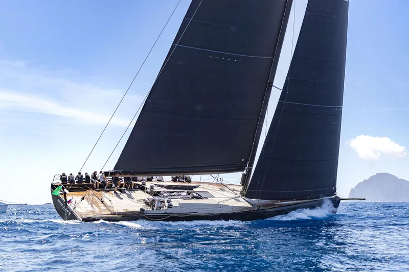 Bullitt Yacht Photos Pics Sleek 2018 Wally Custom yacht sailing on open sea under clear blue sky.
