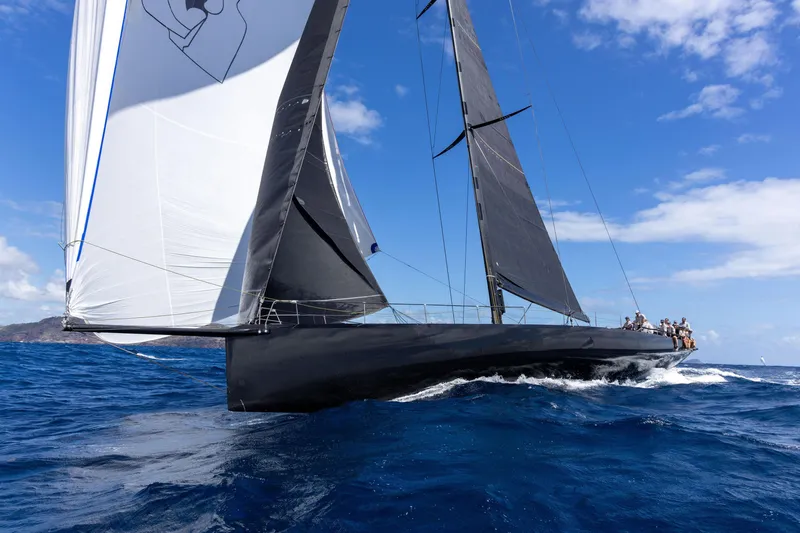 Bullitt Yacht Photos Pics Sleek 2018 Wally Custom sailboat navigating blue ocean under clear skies.