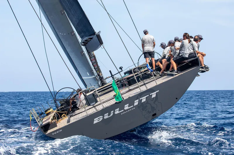 Bullitt Yacht Photos Pics Sailing yacht "Bullitt" by Wally, 2018, with crew racing on open sea.
