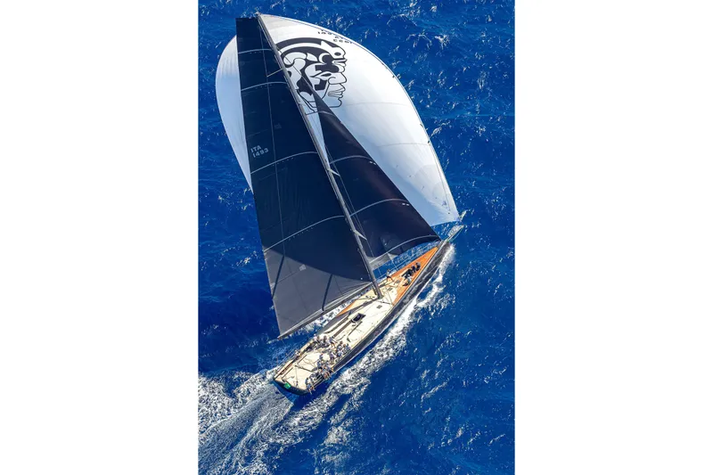 Bullitt Yacht Photos Pics Aerial view of 2018 Wally Custom yacht sailing on vibrant blue ocean.