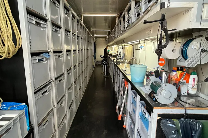 Bullitt Yacht Photos Pics Interior of a 2018 Wally Custom yacht with organized storage and workstations.