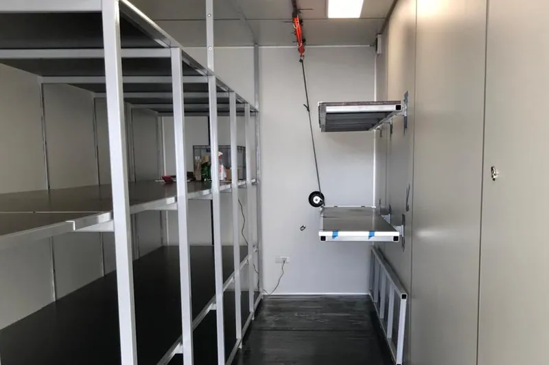 Bullitt Yacht Photos Pics Interior of a 2018 Wally Custom with metal shelving and storage space.