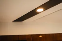 Ceiling light fixture inside 2020 Fairline Targa 45 Open yacht interior.