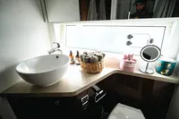 Luxurious bathroom interior of 2020 Fairline Targa 45 Open yacht, featuring modern sink and accessories.