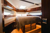 Luxurious cabin interior of 2020 Fairline Targa 45 Open yacht with elegant wood finishes.