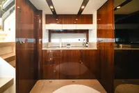 Luxurious interior of 2020 Fairline Targa 45 Open yacht with sleek wooden cabinetry.